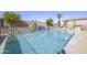 Backyard swimming pool featuring waterfall feature, desert landscaping, and ample space for outdoor seating at 31918 N Caspian Way, San Tan Valley, AZ 85143