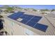 A close aerial shot features installed solar panels, highlighting the home's energy efficiency and modern upgrades at 31918 N Caspian Way, San Tan Valley, AZ 85143