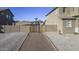 Gated side yard with gravel landscaping, providing a practical and low-maintenance outdoor space at 31918 N Caspian Way, San Tan Valley, AZ 85143