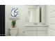 Bright bathroom featuring white vanity with modern fixtures, stylish artwork, and a touch of greenery for a refreshing feel at 32679 N Jasper St, San Tan Valley, AZ 85143