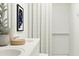 Modern bathroom features double sinks, sleek vanity, and stylish shower with tasteful decor at 32679 N Jasper St, San Tan Valley, AZ 85143