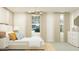 Bright bedroom with neutral tones, offers comfortable bedding, and an abundance of natural light at 32679 N Jasper St, San Tan Valley, AZ 85143