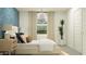 Serene bedroom features patterned wallpaper, pendant lighting, and natural light, creating a tranquil and stylish retreat at 32679 N Jasper St, San Tan Valley, AZ 85143