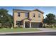 Charming two-story home featuring a neutral color, well-manicured lawn, and attached two-car garage at 32679 N Jasper St, San Tan Valley, AZ 85143
