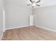Large bedroom with modern ceiling fan, wood-look flooring, and neutral paint at 3321 N Silverado --, Mesa, AZ 85215