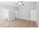 Spacious bedroom featuring high ceilings, wood-look flooring, and ensuite bathroom access at 3321 N Silverado --, Mesa, AZ 85215