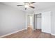 Bedroom featuring wood-look flooring, a ceiling fan, and an open closet at 3321 N Silverado --, Mesa, AZ 85215