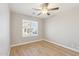 Bedroom featuring wood-look flooring, a ceiling fan, and a window at 3321 N Silverado --, Mesa, AZ 85215