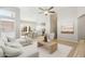 Open-concept living room with wood flooring, natural light, and modern furnishings at 3321 N Silverado --, Mesa, AZ 85215