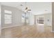 Spacious living room with high ceilings, and sliding glass doors leading to a patio at 3321 N Silverado --, Mesa, AZ 85215