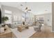 Bright, open living area with vaulted ceiling, fan, and sliding door to the backyard at 3321 N Silverado --, Mesa, AZ 85215