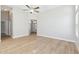Open living area with high ceilings, fan, modern flooring, and view of front entryway at 3321 N Silverado --, Mesa, AZ 85215