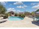 Community pool featuring lounge chairs and picnic seating, perfect for enjoying the sun and outdoor recreation at 3321 N Silverado --, Mesa, AZ 85215