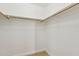 Walk-in closet with wood closet rods and wood-look flooring at 3321 N Silverado --, Mesa, AZ 85215