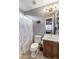 Cozy bathroom with a shower-tub combination and wood vanity at 3911 E Rockingham Rd, Phoenix, AZ 85050