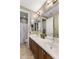 Well-lit bathroom features a double vanity with updated fixtures at 3911 E Rockingham Rd, Phoenix, AZ 85050