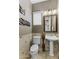 Stylish powder bathroom with decorative wall art and mosaic tile at 3911 E Rockingham Rd, Phoenix, AZ 85050