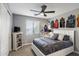 Bright bedroom showcases a TV and unique sports jersey decor at 3911 E Rockingham Rd, Phoenix, AZ 85050