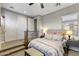 Loft bedroom with closet doors and a stylish bench at 3911 E Rockingham Rd, Phoenix, AZ 85050