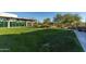 Lush green community lawn area with desert landscaping, shaded seating and common area at 3911 E Rockingham Rd, Phoenix, AZ 85050