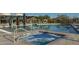 Inviting community hot tub bubbling beside a large swimming pool surrounded by lounge chairs at 3911 E Rockingham Rd, Phoenix, AZ 85050