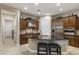 Well-equipped kitchen with custom cabinets, stainless steel appliances, and a functional center island at 3911 E Rockingham Rd, Phoenix, AZ 85050