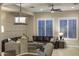 Another angle of the living room featuring modern decor, plush seating, and ample natural light at 3911 E Rockingham Rd, Phoenix, AZ 85050