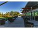 Elegant outdoor lounge area with contemporary seating and lush landscaping at 3911 E Rockingham Rd, Phoenix, AZ 85050