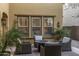 Cozy outdoor patio seating with cushioned chairs and a round fire pit table at 3911 E Rockingham Rd, Phoenix, AZ 85050