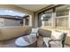 Cozy outdoor patio featuring comfortable seating with chairs and a coffee table at 3911 E Rockingham Rd, Phoenix, AZ 85050