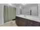 Neutral bathroom featuring a standard shower-tub combination with a dark wood vanity at 3932 W Rene Dr, Chandler, AZ 85226