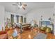 Eclectic bedroom with wood floors, a ceiling fan, and natural light at 3932 W Rene Dr, Chandler, AZ 85226