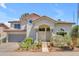 Charming two-story home boasting a tile roof, stucco exterior, and a well-manicured desert landscape at 3932 W Rene Dr, Chandler, AZ 85226