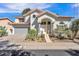 Charming home featuring a two-car garage and desert landscaping in a well-maintained front yard at 3932 W Rene Dr, Chandler, AZ 85226