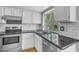 Updated kitchen featuring stainless steel appliances, white subway tile backsplash, and a large window at 3932 W Rene Dr, Chandler, AZ 85226