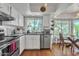 Updated kitchen with white cabinets, stainless appliances, and sunny breakfast nook at 3932 W Rene Dr, Chandler, AZ 85226