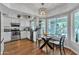 Updated kitchen with white cabinets, stainless appliances, and sunny breakfast nook at 3932 W Rene Dr, Chandler, AZ 85226