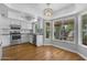 Bright kitchen with stainless steel appliances, hardwood floors, and a bay window at 3932 W Rene Dr, Chandler, AZ 85226