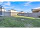 This backyard features grass, a trampoline, and a block wall fence at 40613 N Jerlyn Pl, San Tan Valley, AZ 85140