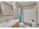 A bathroom with a shower/tub combo, a toilet, a sink, and a mirror at 40613 N Jerlyn Pl, San Tan Valley, AZ 85140