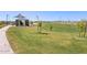 Wide, grassy field in the community park is ideal for walking, relaxing, and outdoor activities at 4152 W Lisa Ln, San Tan Valley, AZ 85144