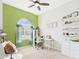 Bright bedroom with green accent wall and arched window at 4164 E Bernice St, Gilbert, AZ 85295