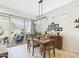 Cozy dining room with natural light, modern light fixture, and view of the outdoor patio at 4164 E Bernice St, Gilbert, AZ 85295
