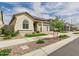 Well maintained home featuring desert landscaping, green turf, and a welcoming front entryway at 4164 E Bernice St, Gilbert, AZ 85295