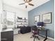Home office with dark built-in desk and floating shelves at 4164 E Bernice St, Gilbert, AZ 85295