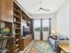 Cozy office featuring built-in bookshelves, a sofa, and a window overlooking the greenery at 4164 E Bernice St, Gilbert, AZ 85295