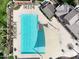 An aerial shot captures the pool with ample seating and shade, creating a relaxing and enjoyable experience at 4164 E Bernice St, Gilbert, AZ 85295