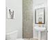 Stylish powder room with mosaic tile accent wall and whimsical llama art at 4164 E Bernice St, Gilbert, AZ 85295