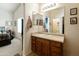 Bright bathroom with a large mirror and a vanity that offers ample storage space at 42370 W Hillman Dr, Maricopa, AZ 85138
