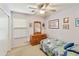 bedroom with a playful aesthetic, natural light, and functional wooden dresser at 42370 W Hillman Dr, Maricopa, AZ 85138